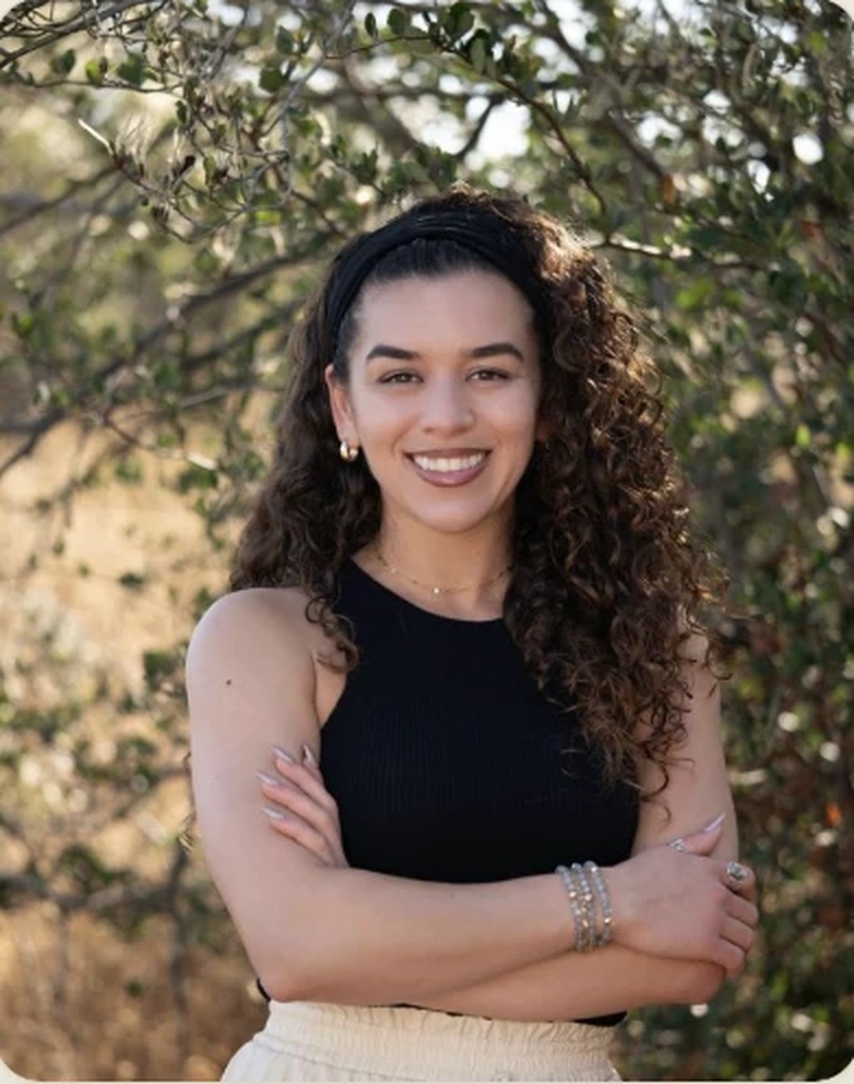 Char-Leen Craner outdoors among greenery